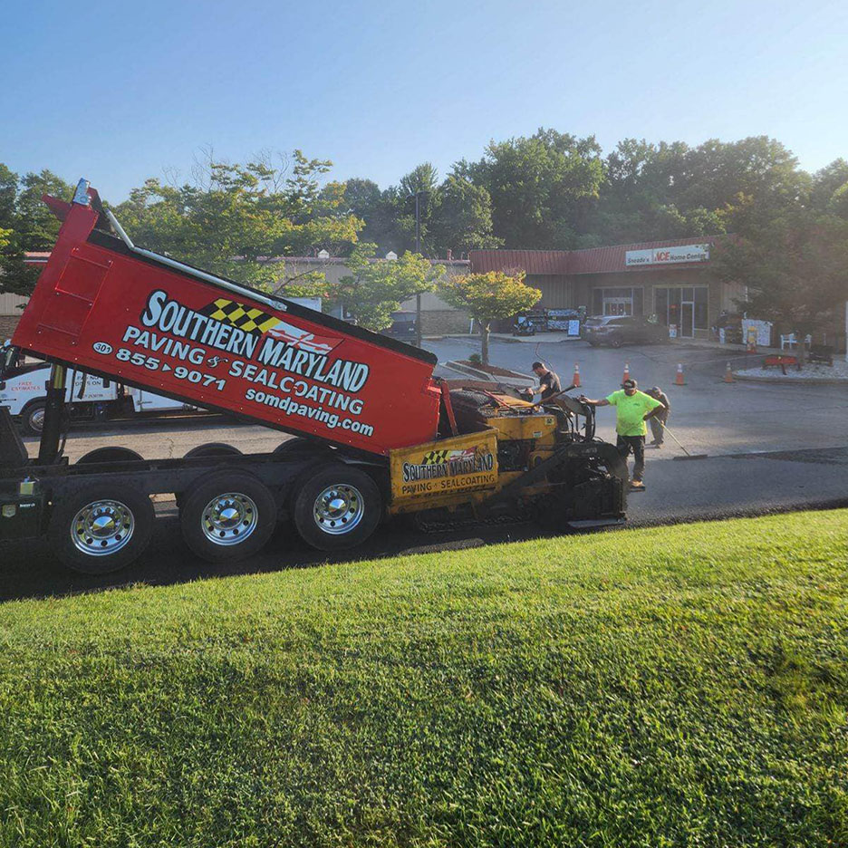 Dumptruck and commercial paving at a shopping complex